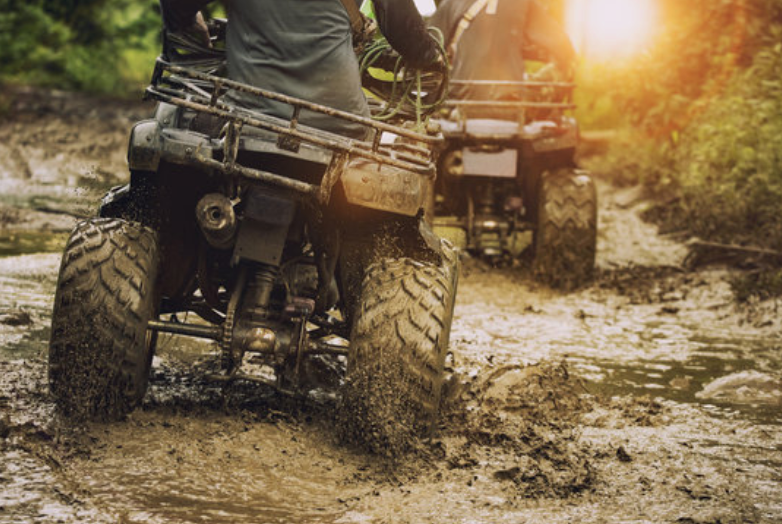 four wheelers being ridden